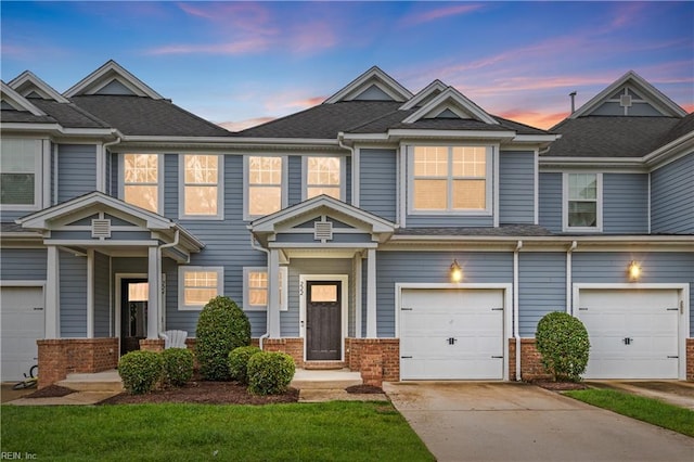 222 Craftsman Cir, Suffolk, VA 23434 - townhome / multi-family property featuring a garage, brick siding, driveway, and roof with shingles