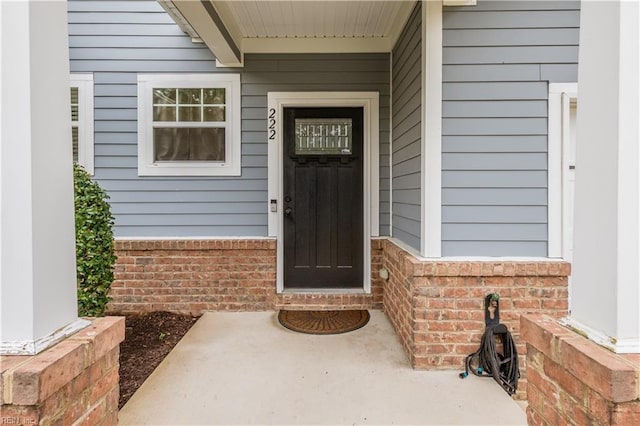 222 Craftsman Cir, Suffolk, VA 23434 - doorway to property with brick siding