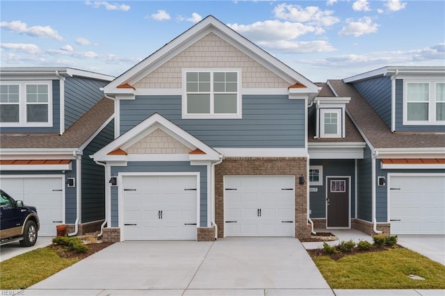 2017 Munro Ln, Chesapeake, VA 23322 - view of front of property featuring driveway, an attached garage, roof with shingles, and stone siding