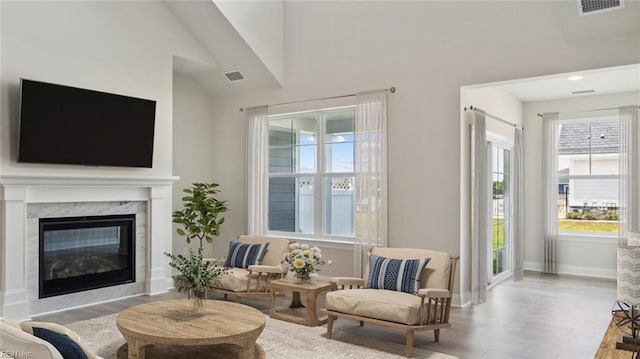 2017 Munro Ln, Chesapeake, VA 23322 - living room featuring wood finished floors, a high end fireplace, lofted ceiling, and recessed lighting