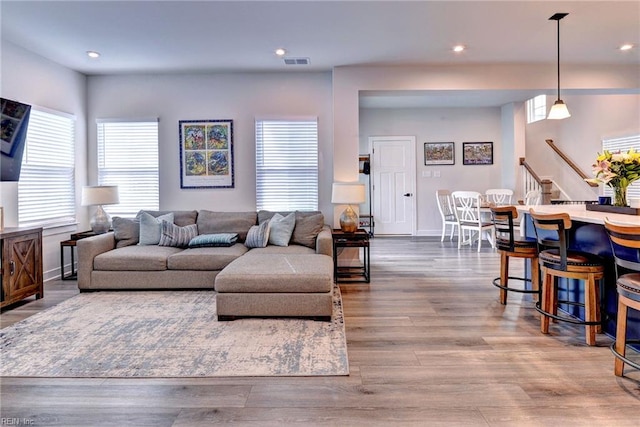 134 Fishermans Way, Poquoson, VA 23662 - living area featuring stairway, healthy amount of natural light, wood finished floors, and recessed lighting