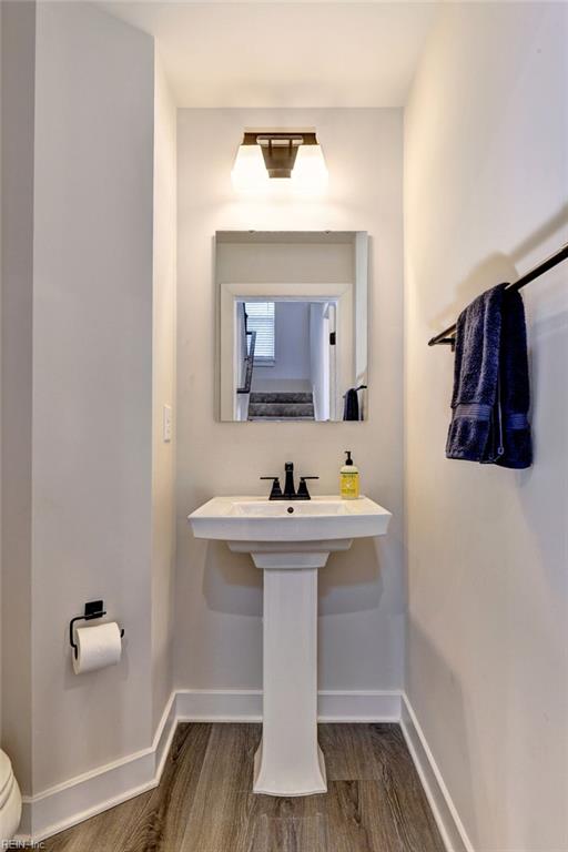 134 Fishermans Way, Poquoson, VA 23662 - bathroom with baseboards and wood finished floors