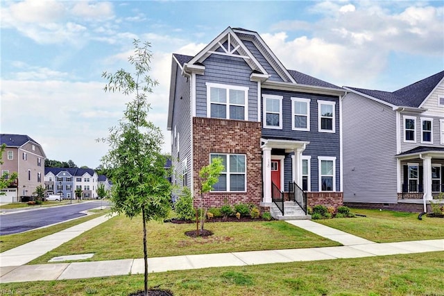 134 Fishermans Way, Poquoson, VA 23662 - view of front of house with brick siding, a front yard, and a residential view