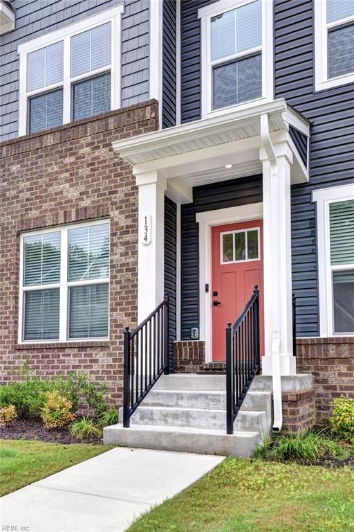 134 Fishermans Way, Poquoson, VA 23662 - property entrance featuring brick siding