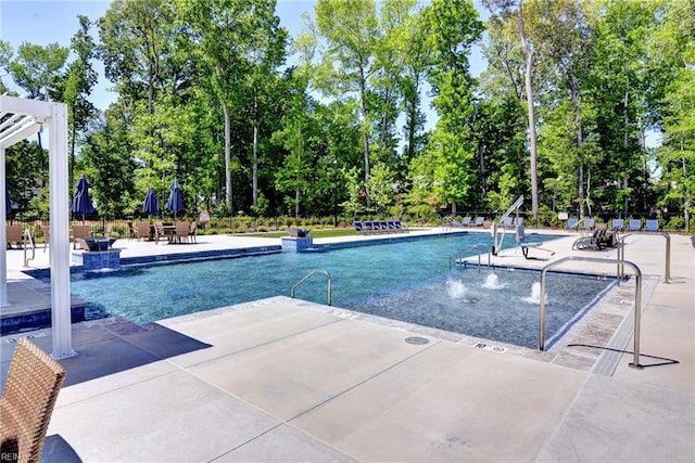 134 Fishermans Way, Poquoson, VA 23662 - community pool featuring a patio area and view of scattered trees