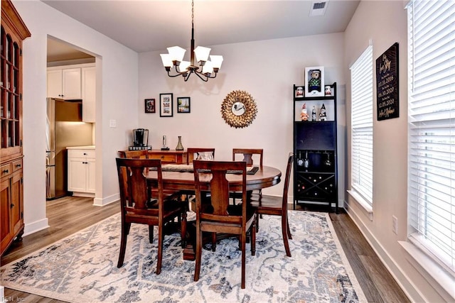 134 Fishermans Way, Poquoson, VA 23662 - dining area featuring wood finished floors and a chandelier