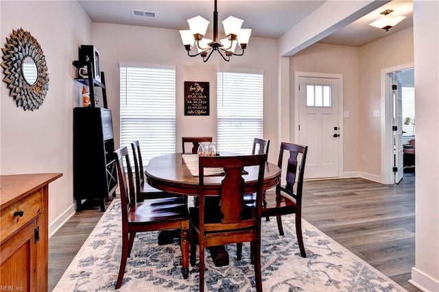 134 Fishermans Way, Poquoson, VA 23662 - dining area featuring a chandelier and dark wood-style floors