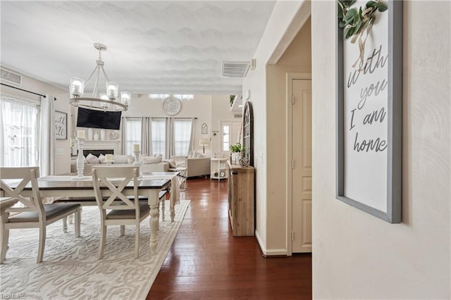 6729 Hampton Roads Pkwy Unit D, Suffolk, VA 23435 - dining area with a chandelier, plenty of natural light, and dark wood finished floors