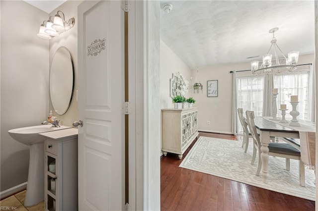 6729 Hampton Roads Pkwy Unit D, Suffolk, VA 23435 - dining space with a chandelier and hardwood / wood-style flooring