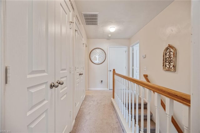 6729 Hampton Roads Pkwy Unit D, Suffolk, VA 23435 - hallway featuring an upstairs landing and light colored carpet