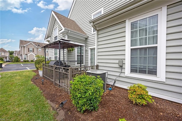 6729 Hampton Roads Pkwy Unit D, Suffolk, VA 23435 - view of property exterior featuring a deck, a yard, and a residential view