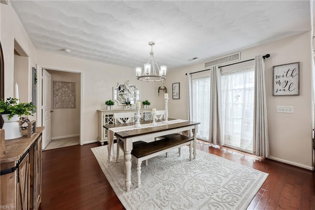 6729 Hampton Roads Pkwy Unit D, Suffolk, VA 23435 - dining space featuring a chandelier and dark wood-type flooring