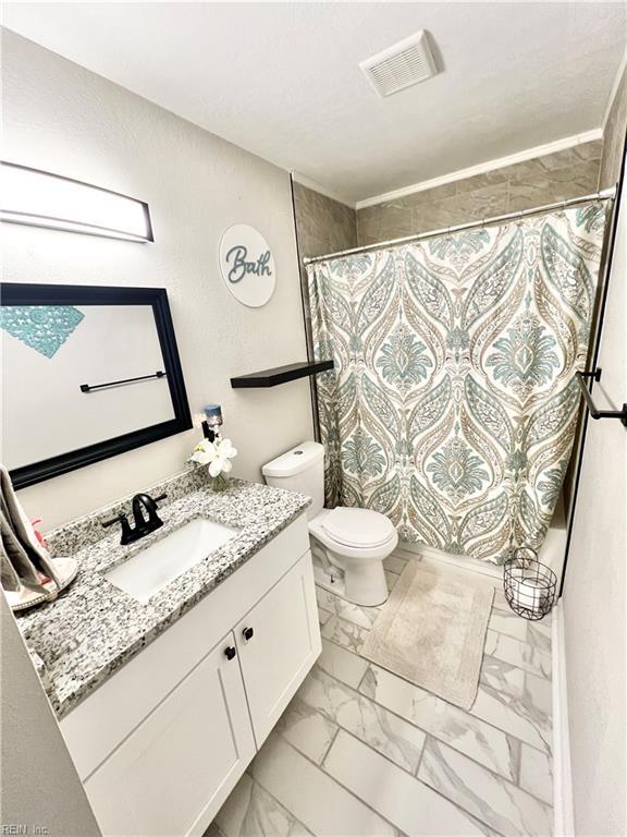 969 Westerly Trl, Virginia Beach, VA 23464 - bathroom with marble finish floors, vanity, and curtained shower