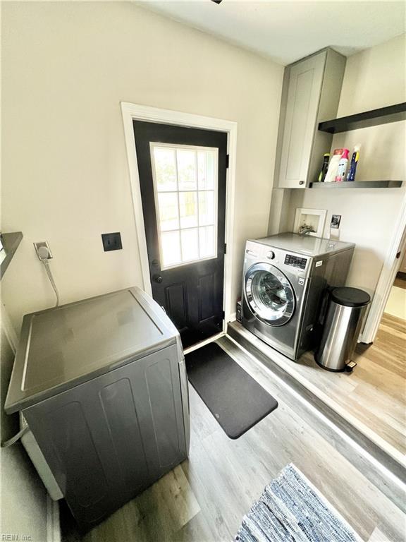 969 Westerly Trl, Virginia Beach, VA 23464 - washroom featuring cabinet space, hookup for a washing machine, and light wood-style floors