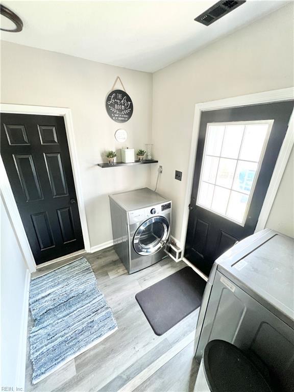 969 Westerly Trl, Virginia Beach, VA 23464 - laundry area featuring wood finished floors and independent washer and dryer