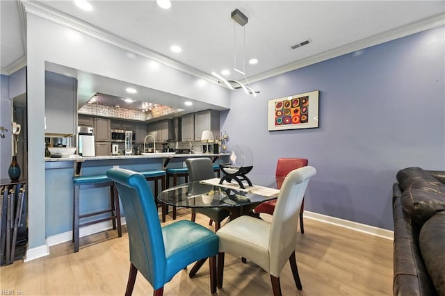 106 Genoa Dr, Hampton, VA 23664 - dining area with ornamental molding, light wood-style floors, and recessed lighting