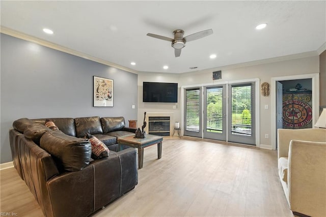 106 Genoa Dr, Hampton, VA 23664 - living area with a ceiling fan, crown molding, light wood-style floors, a glass covered fireplace, and recessed lighting