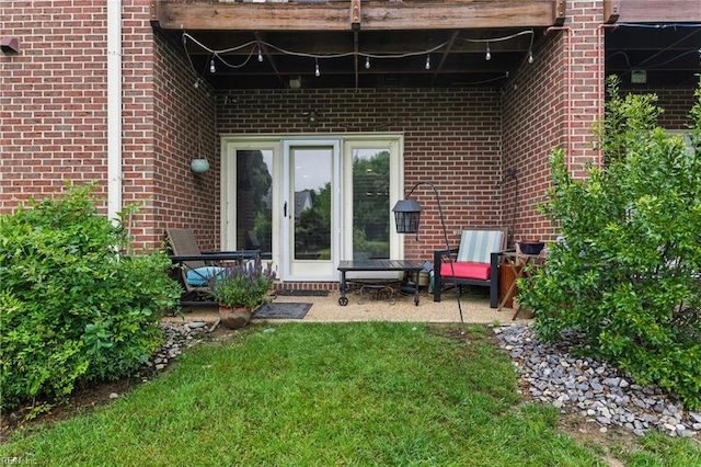 106 Genoa Dr, Hampton, VA 23664 - entrance to property with brick siding, a lawn, and a patio area