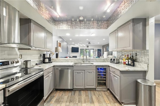 106 Genoa Dr, Hampton, VA 23664 - kitchen with appliances with stainless steel finishes, gray cabinets, light wood-style flooring, and wine cooler