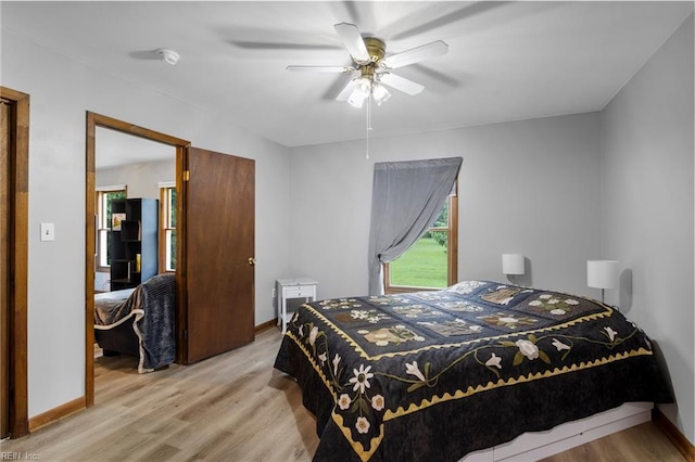 11855 Harcum Rd, Gloucester, VA 23061 - bedroom with light wood-style flooring and ceiling fan
