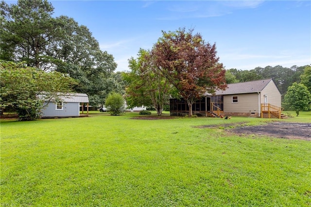 11855 Harcum Rd, Gloucester, VA 23061 - view of green lawn with a sunroom