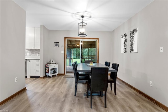 11855 Harcum Rd, Gloucester, VA 23061 - dining room featuring light wood-type flooring and a chandelier