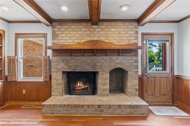 3419 Filly Run, Chesapeake, VA 23323 - unfurnished living room featuring wood finished floors, beam ceiling, a brick fireplace, wainscoting, and ornamental molding