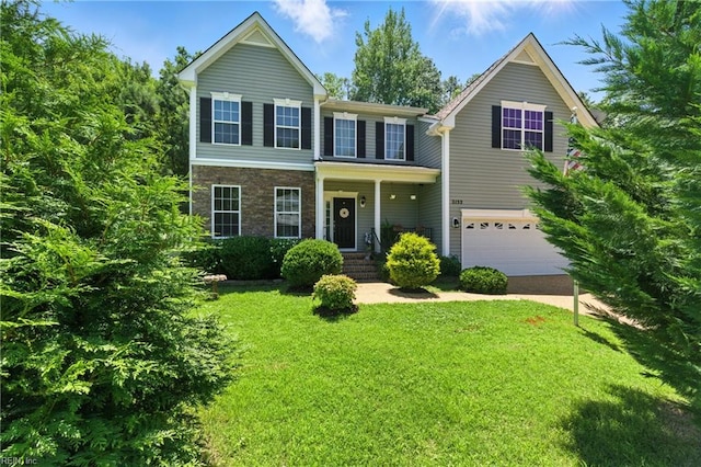 2152 Benomi Dr, Williamsburg, VA 23185 - traditional home featuring a garage, a front lawn, and driveway