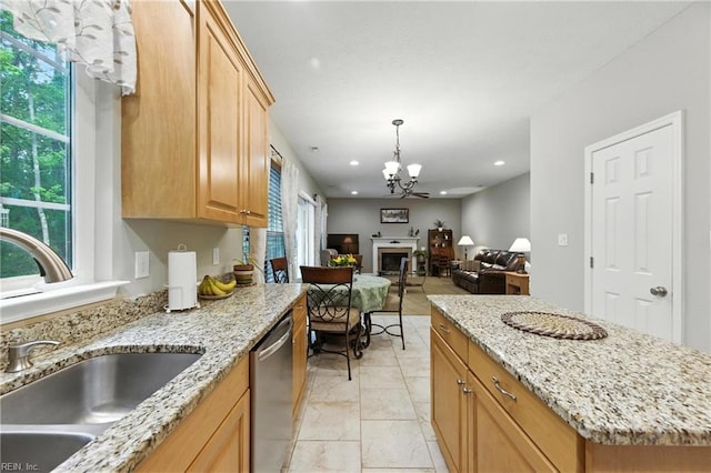 2152 Benomi Dr, Williamsburg, VA 23185 - kitchen with stainless steel dishwasher, a chandelier, open floor plan, a fireplace, and recessed lighting