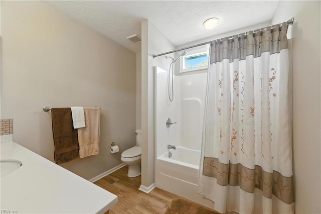 2152 Benomi Dr, Williamsburg, VA 23185 - full bath featuring wood finished floors, shower / tub combo, vanity, and a textured ceiling