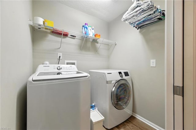 2152 Benomi Dr, Williamsburg, VA 23185 - laundry area with separate washer and dryer and wood finished floors