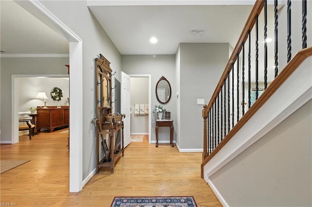 2152 Benomi Dr, Williamsburg, VA 23185 - entrance foyer with light wood finished floors, stairs, recessed lighting, and crown molding