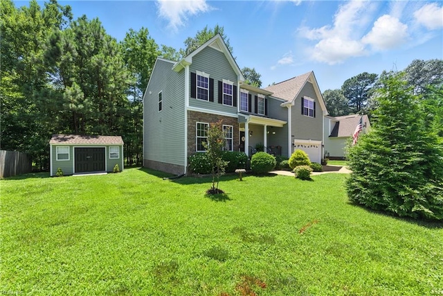 2152 Benomi Dr, Williamsburg, VA 23185 - view of front facade with a garage and a storage shed