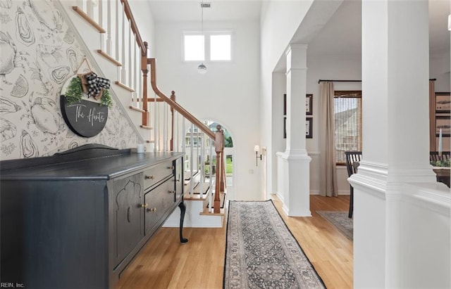 119 Grand View Dr, Hampton, VA 23664 - foyer with decorative columns, stairway, and light wood finished floors