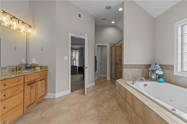 860 Greenfield Ln, Chesapeake, VA 23322 - bathroom with vanity, a stall shower, a tub with jets, and vaulted ceiling