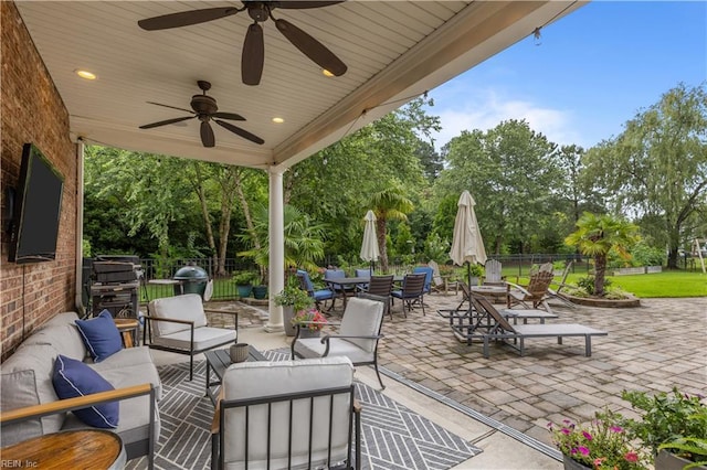 860 Greenfield Ln, Chesapeake, VA 23322 - view of patio / terrace with an outdoor hangout area, outdoor dining area, view of wooded area, ceiling fan, and grilling area