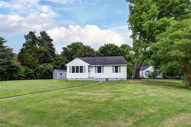 513 W Maynor Dr, Williamsburg, VA 23185 - view of front facade featuring a front lawn, crawl space, and a storage shed