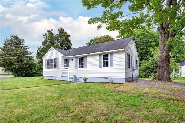 513 W Maynor Dr, Williamsburg, VA 23185 - view of front of property with crawl space, a front yard, and a shingled roof