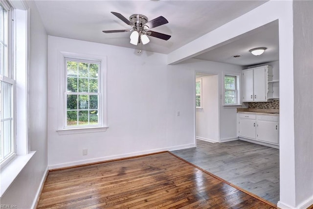 513 W Maynor Dr, Williamsburg, VA 23185 - unfurnished living room featuring wood finished floors and a ceiling fan