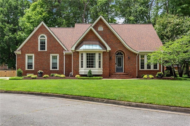 713 Tupelo Xing, Chesapeake, VA 23320 - view of front of house featuring brick siding, entry steps, and a shingled roof