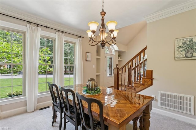 713 Tupelo Xing, Chesapeake, VA 23320 - dining space featuring a chandelier, carpet flooring, plenty of natural light, stairway, and crown molding