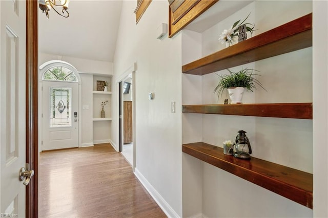 713 Tupelo Xing, Chesapeake, VA 23320 - entryway with wood finished floors, a chandelier, and vaulted ceiling