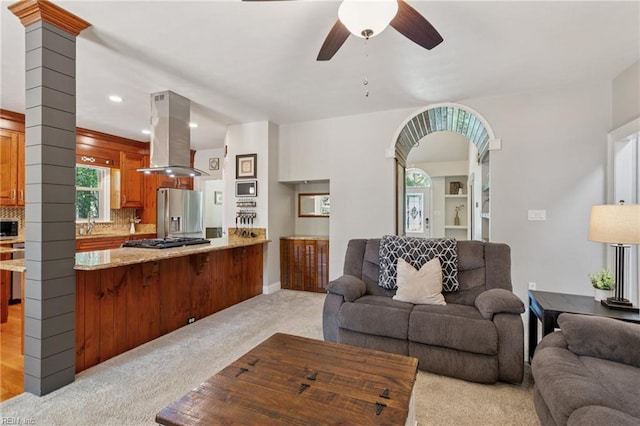 713 Tupelo Xing, Chesapeake, VA 23320 - living area featuring light carpet, ceiling fan, recessed lighting, and arched walkways