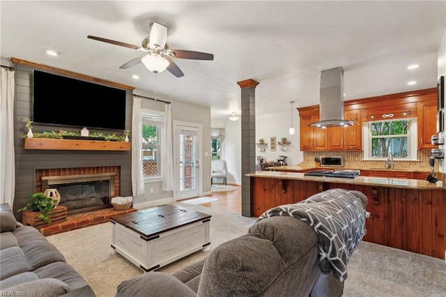 713 Tupelo Xing, Chesapeake, VA 23320 - living room with a ceiling fan, recessed lighting, a brick fireplace, and light carpet