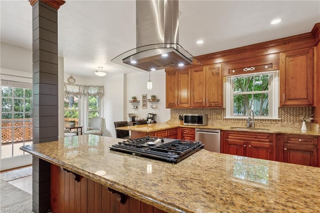 713 Tupelo Xing, Chesapeake, VA 23320 - kitchen with island range hood, stainless steel appliances, light stone countertops, decorative columns, and recessed lighting
