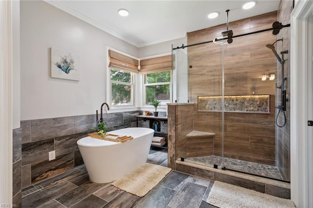 713 Tupelo Xing, Chesapeake, VA 23320 - full bathroom featuring tile walls, a freestanding tub, a shower stall, ornamental molding, and a wainscoted wall