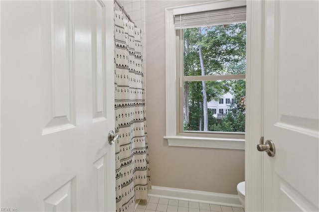 713 Tupelo Xing, Chesapeake, VA 23320 - bathroom featuring a shower with shower curtain and tile patterned flooring