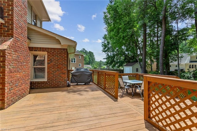 713 Tupelo Xing, Chesapeake, VA 23320 - wooden deck with a storage shed, outdoor dining space, and area for grilling