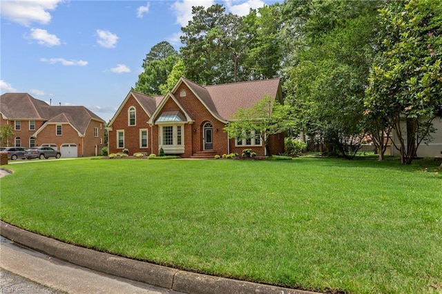 713 Tupelo Xing, Chesapeake, VA 23320 - view of front of house featuring a front lawn and brick siding