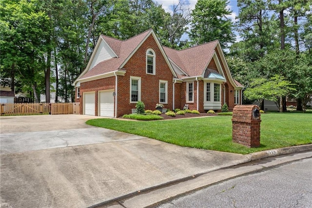 713 Tupelo Xing, Chesapeake, VA 23320 - view of front of house with brick siding, concrete driveway, a garage, and roof with shingles